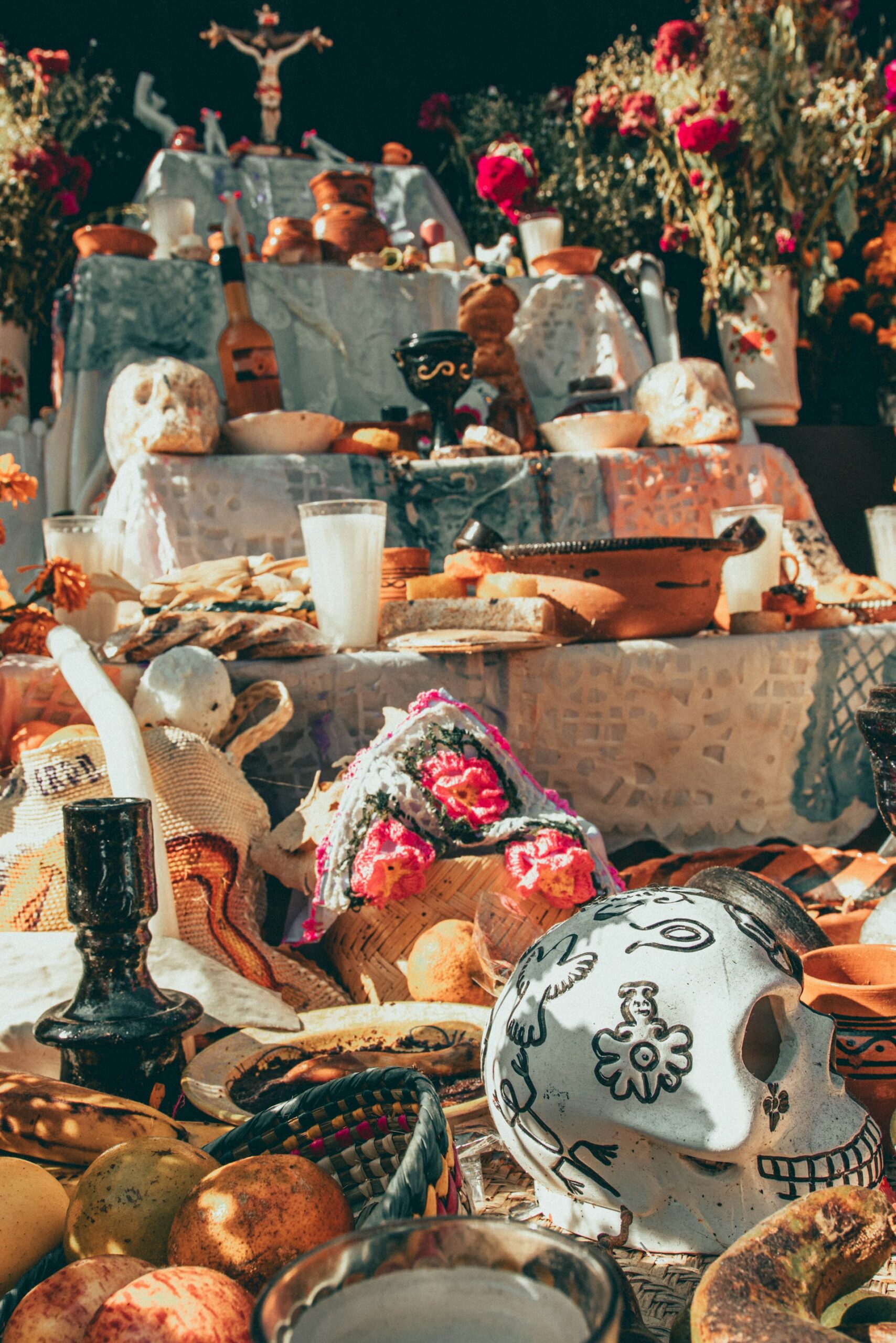 Day of the Dead altar with candles and marigolds symbolizing remembrance and legacy.